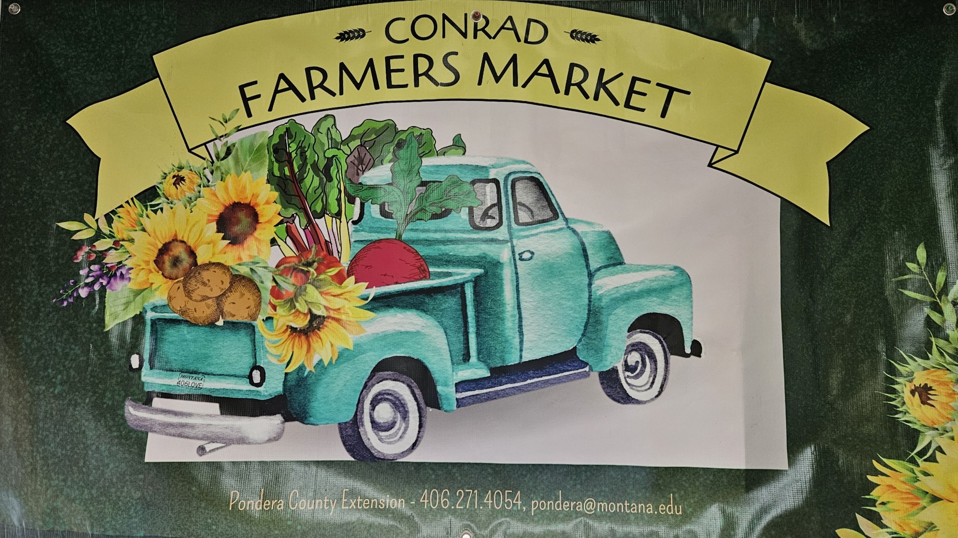 Welcome banner at the Conrad Farmers Market